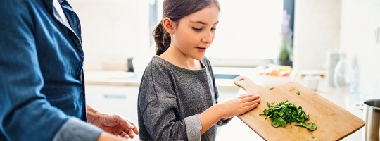 Kid Cooking in Kitchen