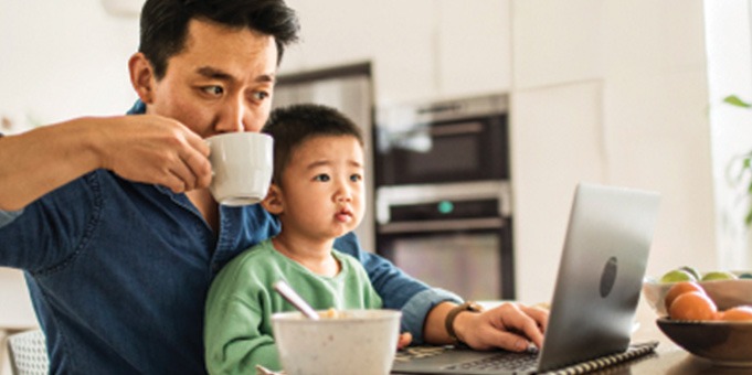 Father and Son Sitting Together for Breakfast
